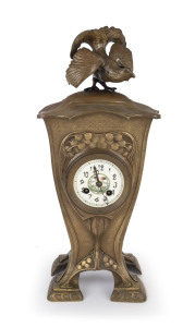 A French Art Nouveau bronze cased mantel clock with enamel dial, time and strike movement, case engraved with dedication and dated 1911, ​48cm high