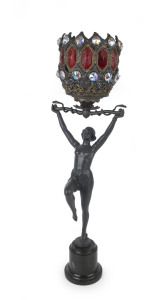 A German Art Deco figural lamp, cast metal with Bohemian metal and glass shade, circa 1930, ​74cm high