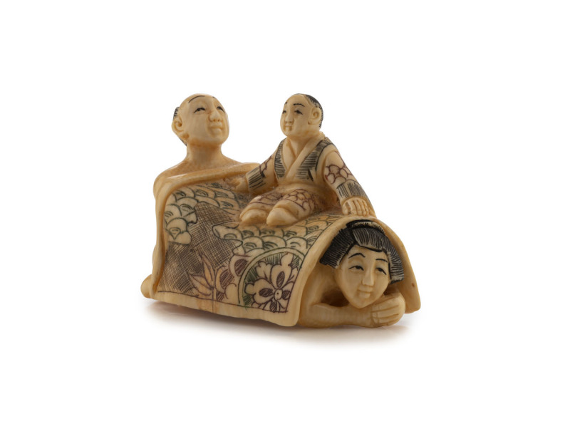 A Japanese erotic carved ivory netsuke with hand-coloured finish, 20th century, 4cm high, 5cm long