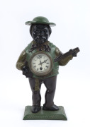 Jolly Banjo Player clock in painted cast iron case, timepiece only with moving eyes, 20th century, ​38cm high