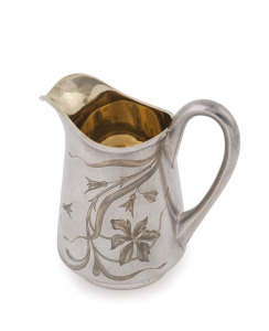 A Russian silver jug with engraved floral motif, by ALEKSANDR FAUD of Moscow, circa 1900, stamped "84" with Cyrillic maker's mark, 10cm high, 10cm wide, 158 grams