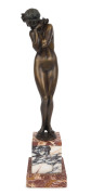 CLAIRE COLINET (1880 - 1950), Darling, circa 1920, bronze on a marble base, signed "Cl. J.R. Colinet", foundry seal inset in base "MHM", ​36cm (48cm with base).