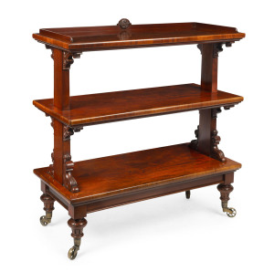 An English mahogany three tier dumbwaiter, cedar secondary timbers with original brass castors, circa 1870, 120cm high, 113cm wide, 48cm deep