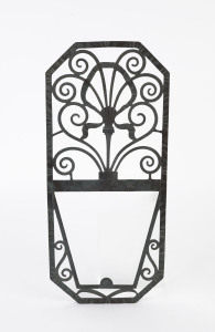 A French wrought iron mirror/picture frame, circa 1920, stamped with maker's monogram (illegible), 41.5cm x 18.5cm