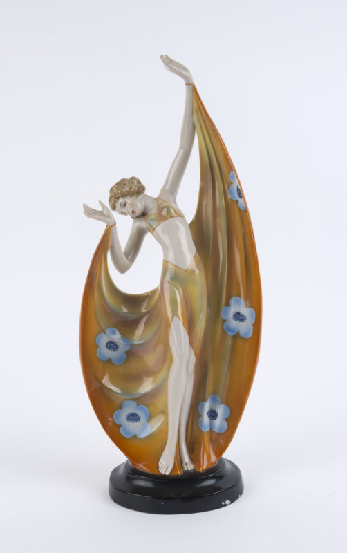 A Continental porcelain Art Deco statue of a dancing lady, circa 1930, 35cm high