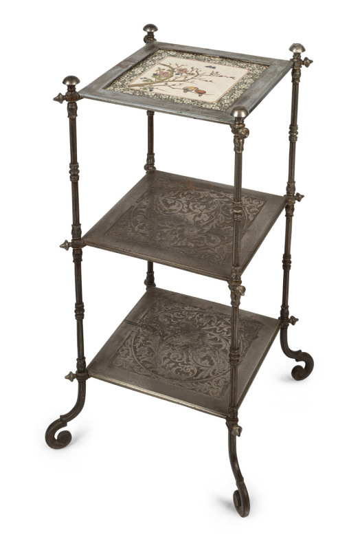 An English Arts & Crafts three tier wotnot, nickel plated cast metal with cockatoo motif and inset tile top, 19th century, 80cm high, 42cm wide, 42cm deep