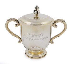 A sterling silver gilt lidded cup by Hardy Brothers, with engraved Royal Coat of Arms and inscribed legend "The Queens Cup - Presented by / Her Majesty Queen Elizabeth II", 20cm high, 885 grams.