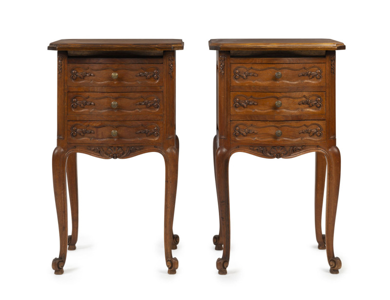 A pair of French Louis XV style provincial oak three drawer bedside cabinets, 20th century, 76cm high, 45cm wide, 35cm deep