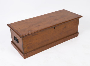 An antique pine trunk with iron handles, 19th century, 31cm high, 89cm wide, 37cm deep