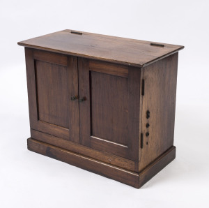 A two door blackwood cabinet with lift top and radio jack ports on sides, early 20th century, ​43cm high, 53cm wide, 28cm deep