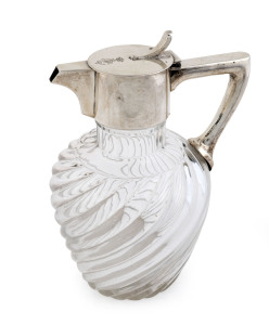An Austro-Hungarian silver mounted fluted glass wine jug, with engraved coronet and script initials, 19cm high.
