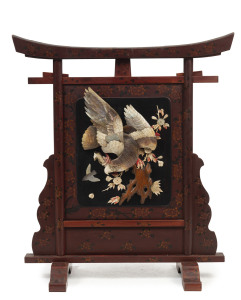 A Japanese Shibayama red lacquer fire screen, Meiji period, 19th century, 85cm high, 75cm wide