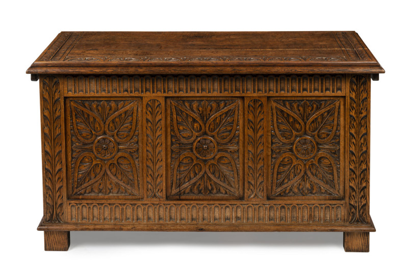 An antique carved English oak coffer, 18th/19th century, 69cm high, 121cm wide, 51cm deep