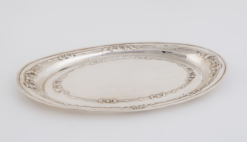 An Edward VII sterling silver oval dish with embossed tied ribbons, by F.H. Adams Ltd., Birmingham, 1909,