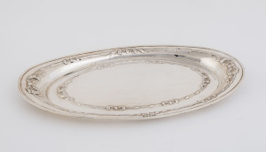 An Edward VII sterling silver oval dish with embossed tied ribbons, by F.H. Adams Ltd., Birmingham, 1909,