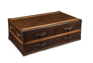 An impressive timber and leather bound suitcase style coffee table, 20th century, 44cm high, 130cm wide, 80cm deep