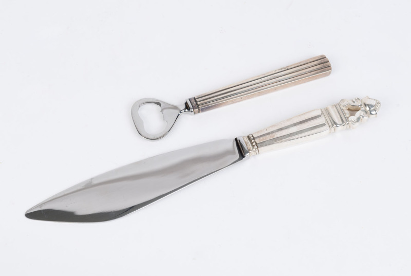 GEORG JENSEN "Acorn" design Danish silver cake knife (26.5cm long), together with a sterling silver "Bernadotte" design bottle opener (15.3cm). (2 items).