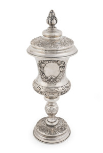 A European silver goblet with fitted cover, floral decorations, floral finial, gilt interior, circa 1900,