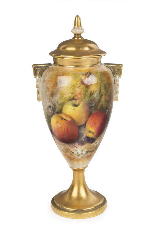 ROYAL WORCESTER English porcelain urn decorated with fruit and flowers, signed "RICKETTS", circa 1929, purple factory mark to base, 20cm high