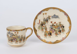 SATSUMA Japanese earthenware teacup and saucer decorated with processional figures, the saucer 11.5cm diameter