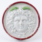 An antique French porcelain furniture knob with Medusa head motif, 18th/19th century, 9.5cm diameter - 2