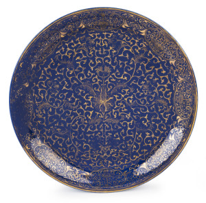 A Chinese blue porcelain charger with gilt decoration, 19th century, six character mark to base, 37.5cm wide