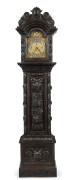 An impressive English grandfather clock, triple train three weight movement with chime and strike, housed in ornately carved oak case, ​19th century, 244cm high