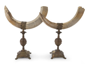 A pair of antique French table ornaments, hippo tooth and bronze, mid 19th century, 40cm high, 30cm wide