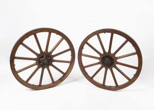 A pair of vintage wooden spoke wheels with iron rims, ​78cm diameter