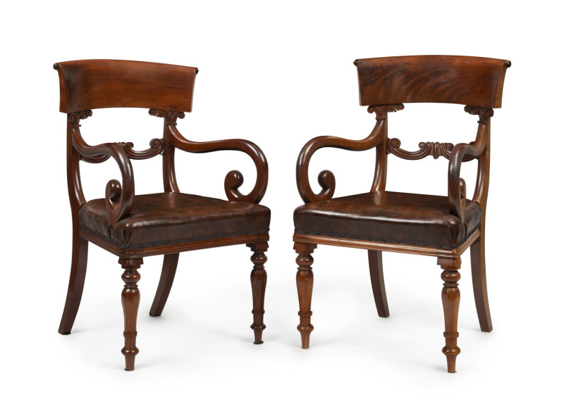 A pair of antique English carver chairs, flame mahogany with brown leatherette upholstery, circa 1840, ​52cm across the arms