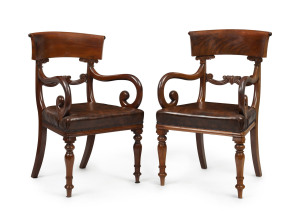 A pair of antique English carver chairs, flame mahogany with brown leatherette upholstery, circa 1840, 52cm across the arms