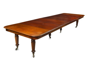 An impressive antique English William IV mahogany banquet table, six finely turned and hexagonal tapering form legs with five additional leaves, circa 1840, 74cm high, 116cm wide (extends to 426cm), 130cm deep