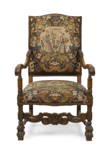 An antique French carved walnut armchair with tapestry upholstery, 19th century, 64cm across the arms