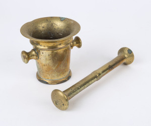 An antique brass mortar and pestle, 10.5cm high, 13cm wide