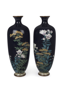 A pair of Japanese cloisonne vases with lilies and blossoms on blue ground, Meiji period, 24cm high
