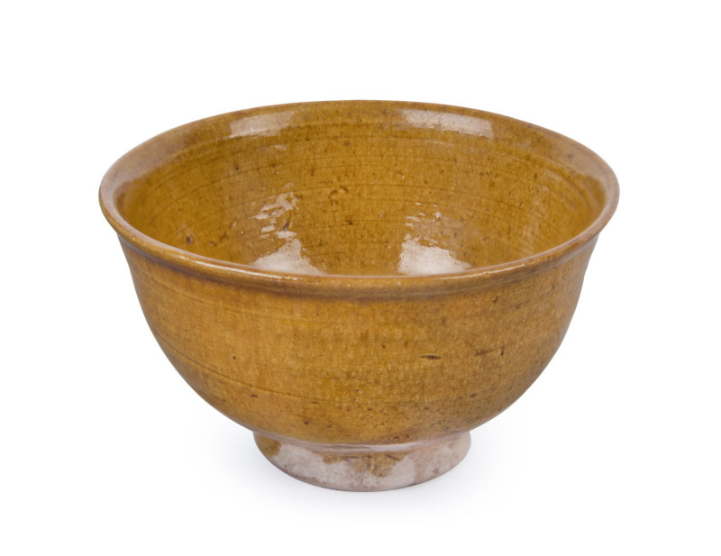 A Chinese amber glazed tea bowl, Liao Dynasty (907-1125), 5.5cm high, 9.5cm diameter. PROVENANCE: Jason E. Sprague Collection, Melbourne/London