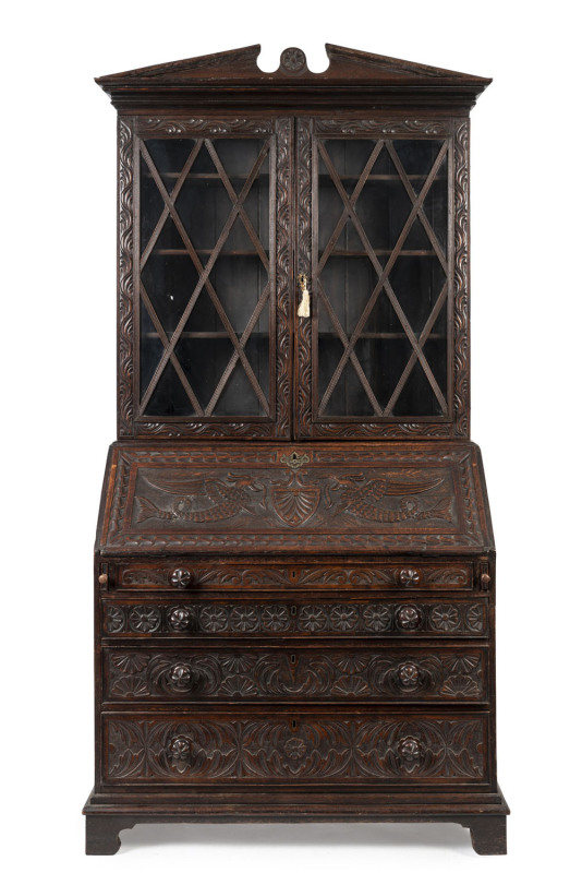An English Georgian oak bureau bookcase, circa 1780, interior fitted with numerous pigeonholes and drawers, 232cm high, 112cm wide, 58cm deep