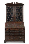 An English Georgian oak bureau bookcase, circa 1780, interior fitted with numerous pigeonholes and drawers, 232cm high, 112cm wide, 58cm deep