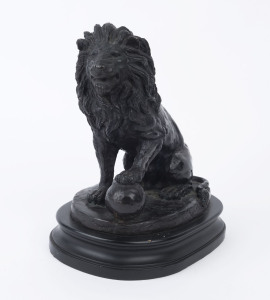 A bronze lion statue on ebonised timber base, 20th century, 30cm high