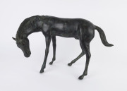 A cast bronze statue of a horse, 20th century, 38cm high, 62cm long