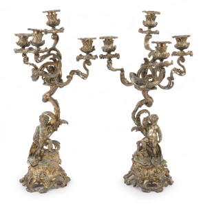 A pair of antique ormolu French figural four branch candelabras, 19th century, 50cm high