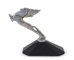 An Art Deco chrome finished car mascot on later shaped wooden plinth, circa 1930, 14cm high overall