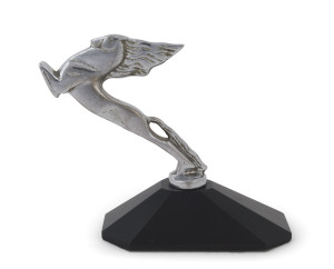 An Art Deco chrome finished car mascot on later shaped wooden plinth, circa 1930, ​14cm high overall