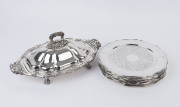 A large silver plated rococo style lidded entrée dish with 10 silver plated dining plates, 20th century, (11 items), the dish 43cm wide, the plates 30cm diameter.