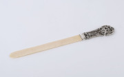 An antique silver and ivory page turner, 19th century, 35cm long