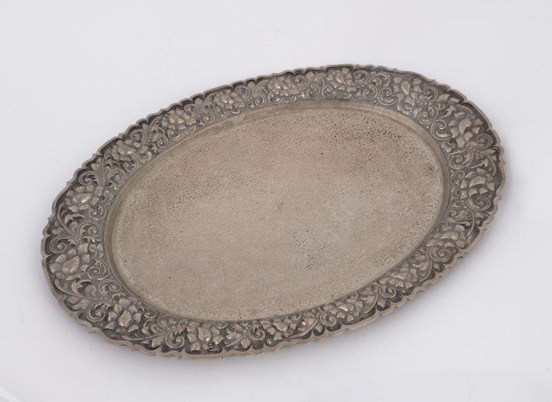 A Yogya Dutch East Indies silver oval platter with floral design border, early 20th century, marked "AD 800", 520 grams.