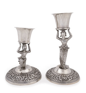 A rare pair of antique Burmese silver goblets supported by solid cast male and female figurines dressed in elegant costumes of the Konbaung Court (1752-1885), Rangoon, Burma, 1880-1890, Male 18.8cm, 594 grams. Female 23.4cm, 674 grams. - CLICK HERE FOR DE