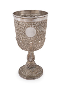 An impressive antique Indian silver chalice decorated with animal hunting scenes amidst ornate repoussé floral motif, most likely Kutch, Northern India, 19th century, 21.5cm high, 500 grams