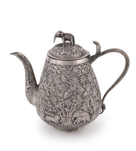 An antique Indian silver teapot decorated with palm trees, tiger hunting scene, cobra handle and elephant handle, 19th century, ​19cm high, 580 grams