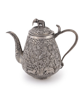 An antique Indian silver teapot decorated with palm trees, tiger hunting scene, cobra handle and elephant handle, 19th century, 19cm high, 580 grams